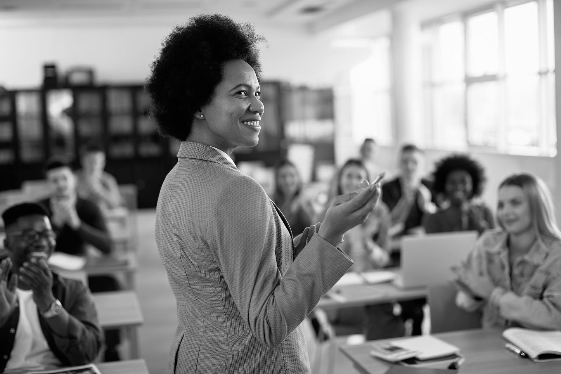 Black female professor heads a class.