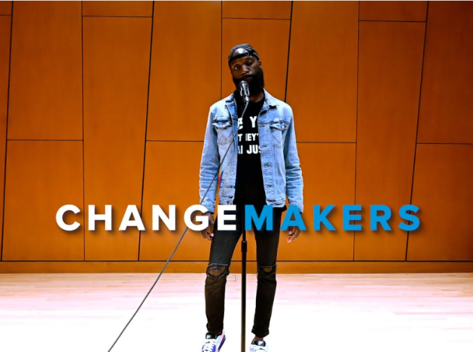 Wilson Okello on stage performing in ChangeMakers video.